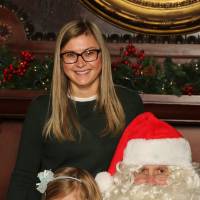 Alumni and daughter with Santa Claus